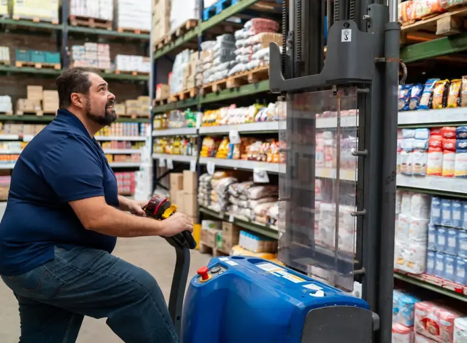 Man on forklift in food warehouse